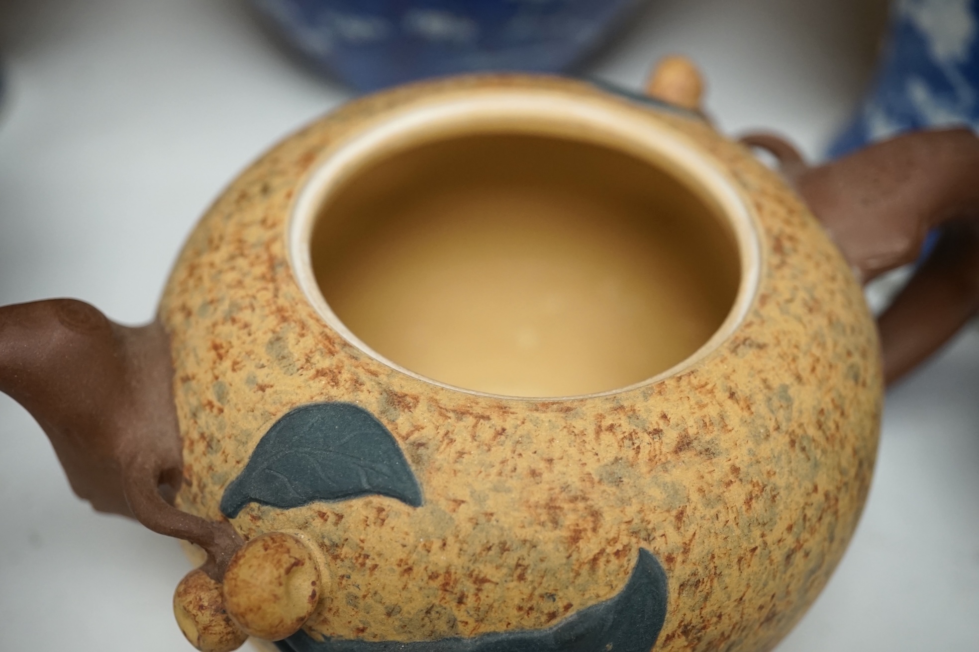 Two Chinese prunus jars and two vases, early 20th century, tallest 26cm, together with two Chinese Yixing pottery teapots, one Republic period, tallest 12.5cm. Condition - varies, poor to fair